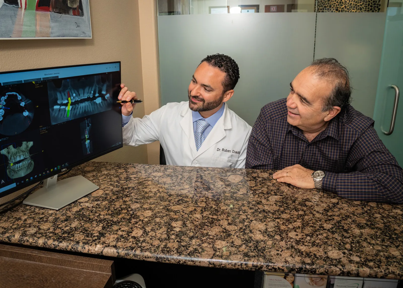 Dr. Ovadia showing a patient an x-ray