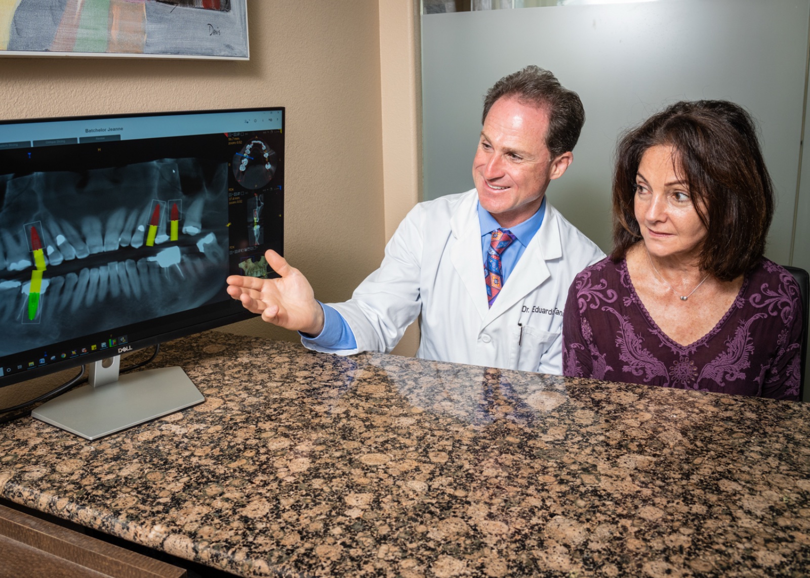 Dr. Ovadia and a patient examine a digital X-ray