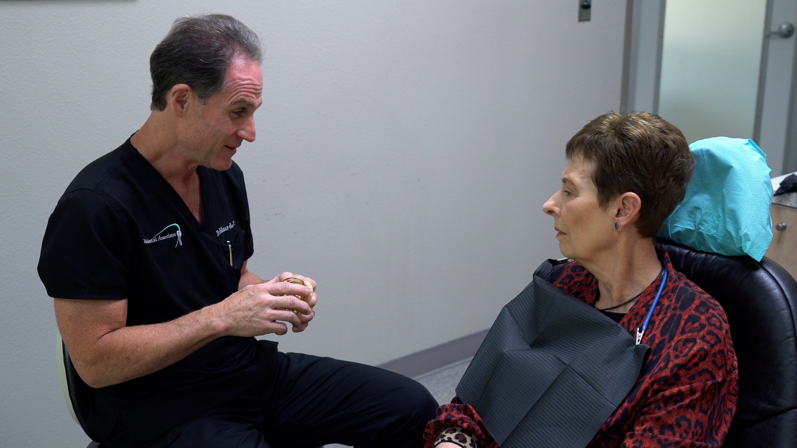 Dr. Tanur discuss treatment with a patient