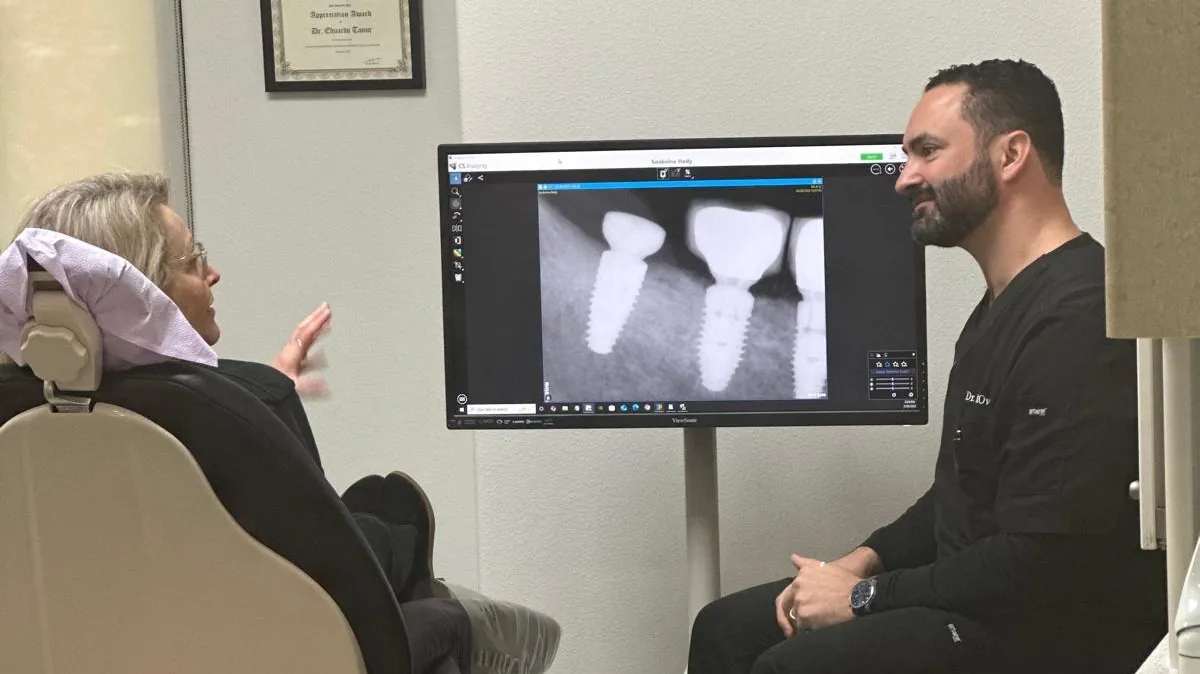 Dr. Ovadia discussing with an implant patient